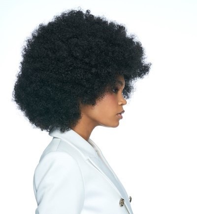 Smiling lady wearing her Natural Fro afro inspired wig
