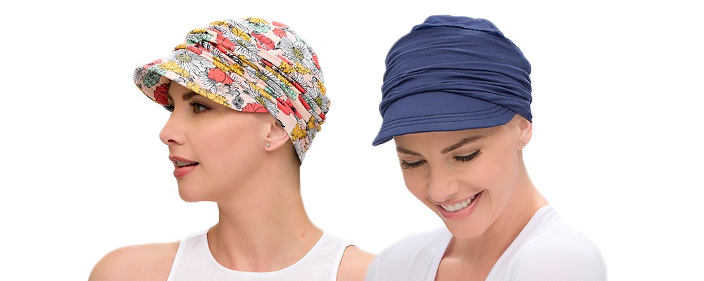 Two women with total hair loss wearing soft bamboo fabric headwear