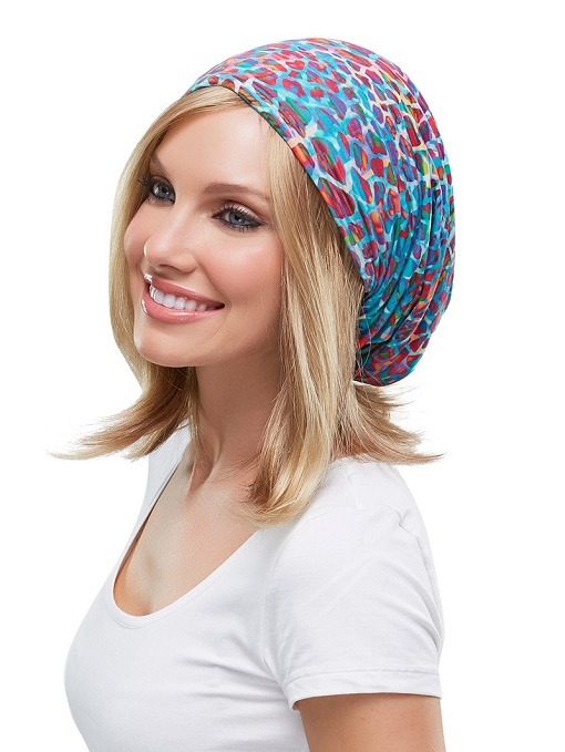 Lady wearing colourful headwear for her bald head