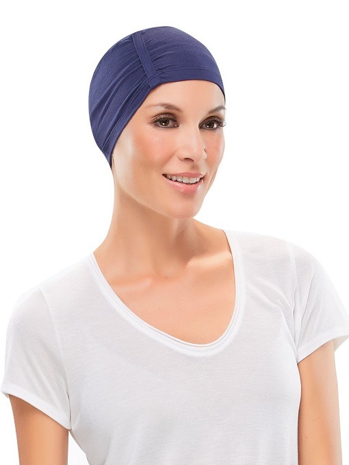 The Casual Softie for women with complete hair loss Lady wearing a blue head piece to keep her head warm