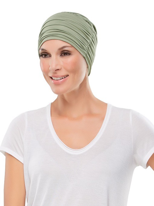 elegant softie Lady with hair loss keeping her head warm