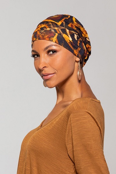 Lady wearing the Soweto nights African head wrap